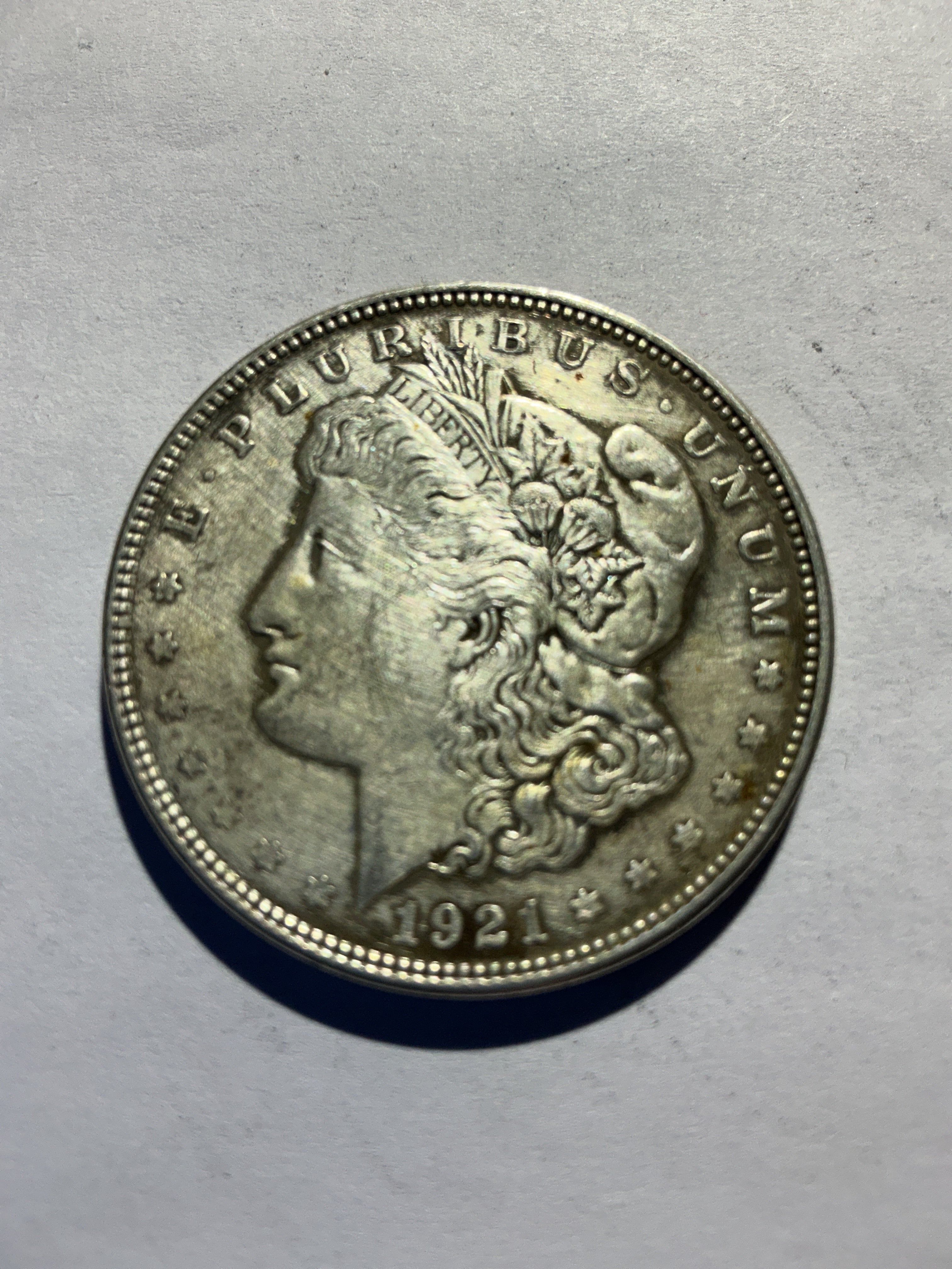 Lot 77,  1921 Morgan silver dollar, AU
