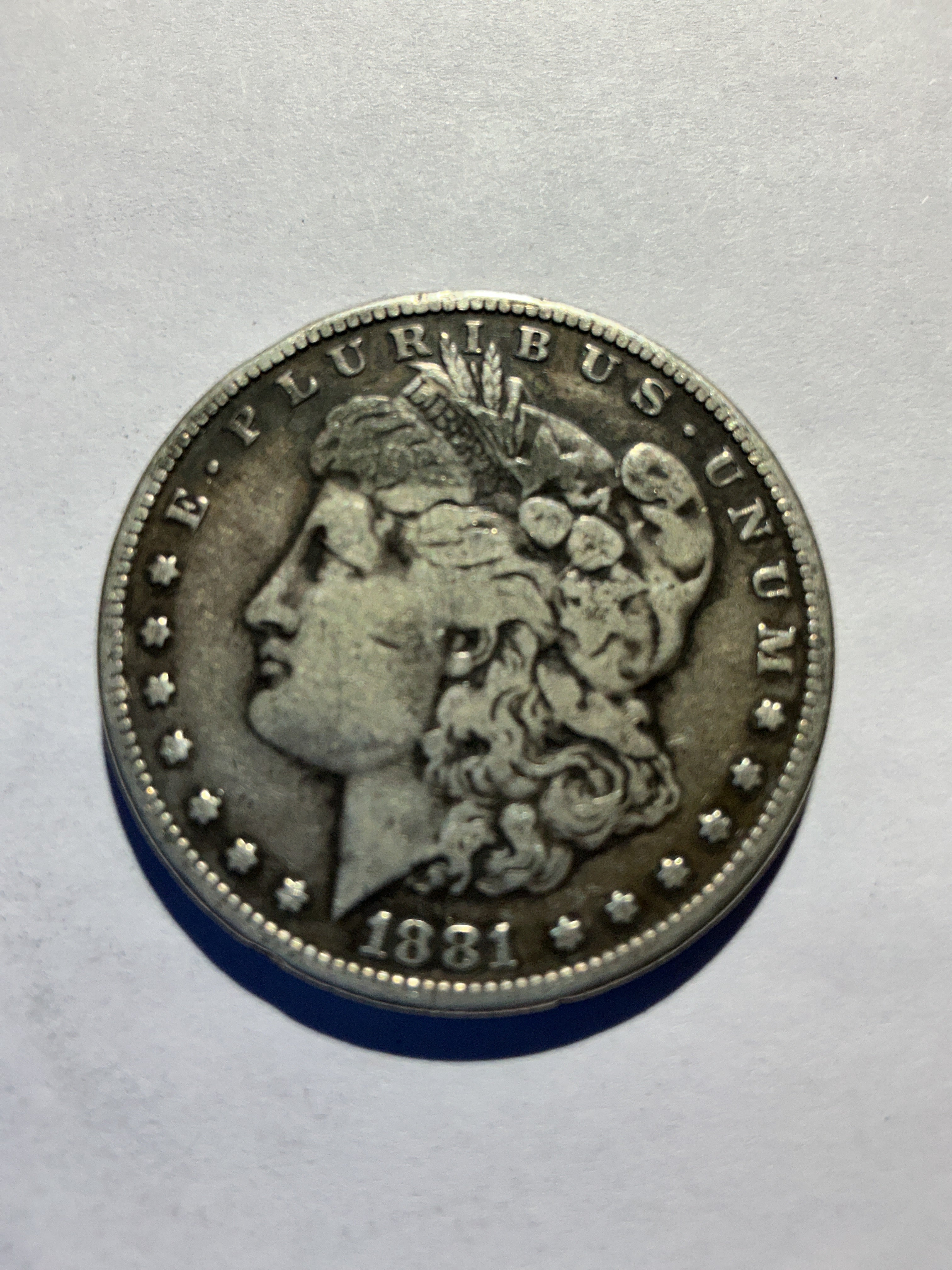 Lot 61, 1881 S Morgan silver dollar,