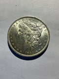 Lot 24, 1884 O Morgan silver dollar,AU