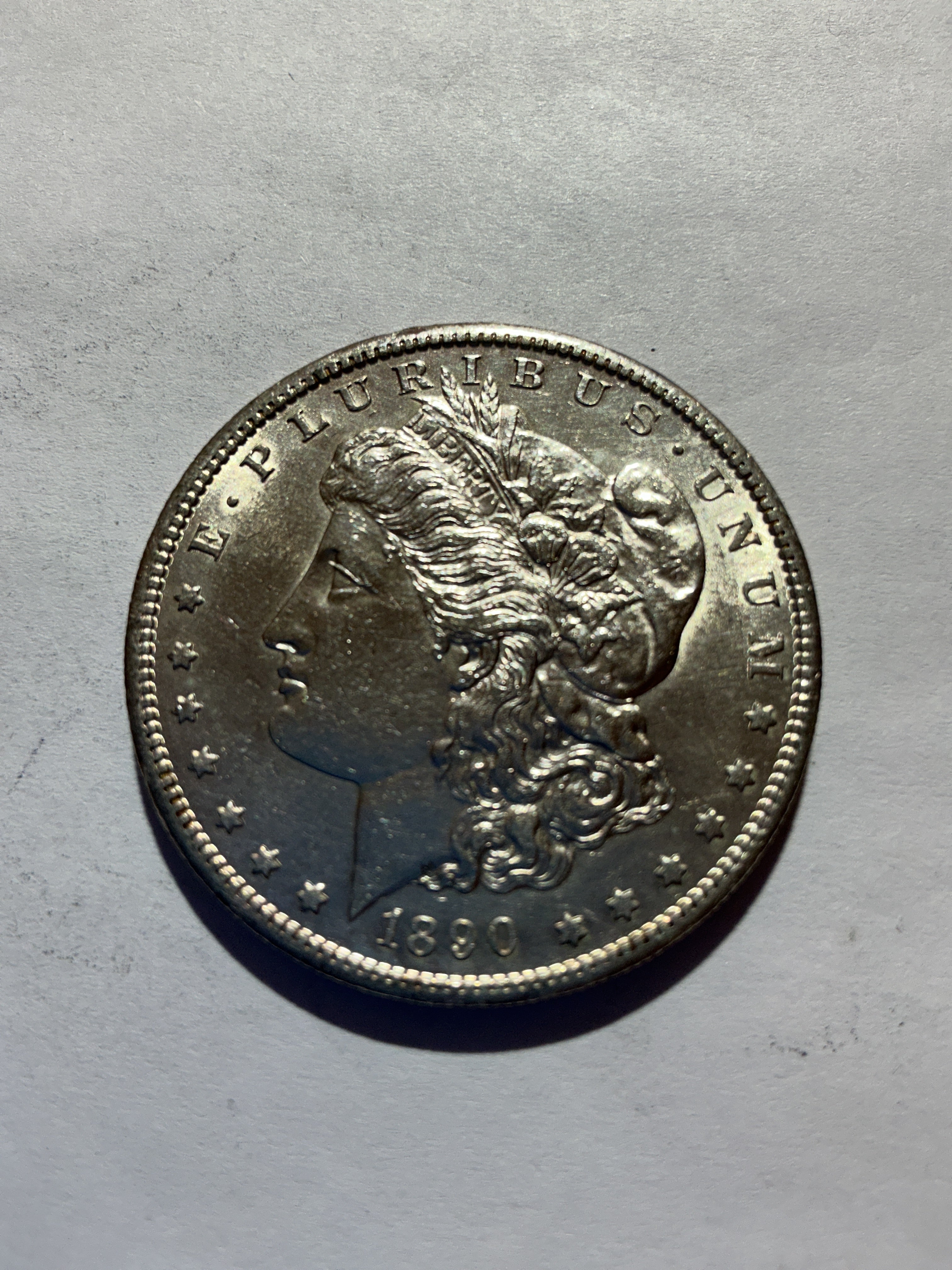 Lot 57, 1890 S Morgan silver dollar, AU