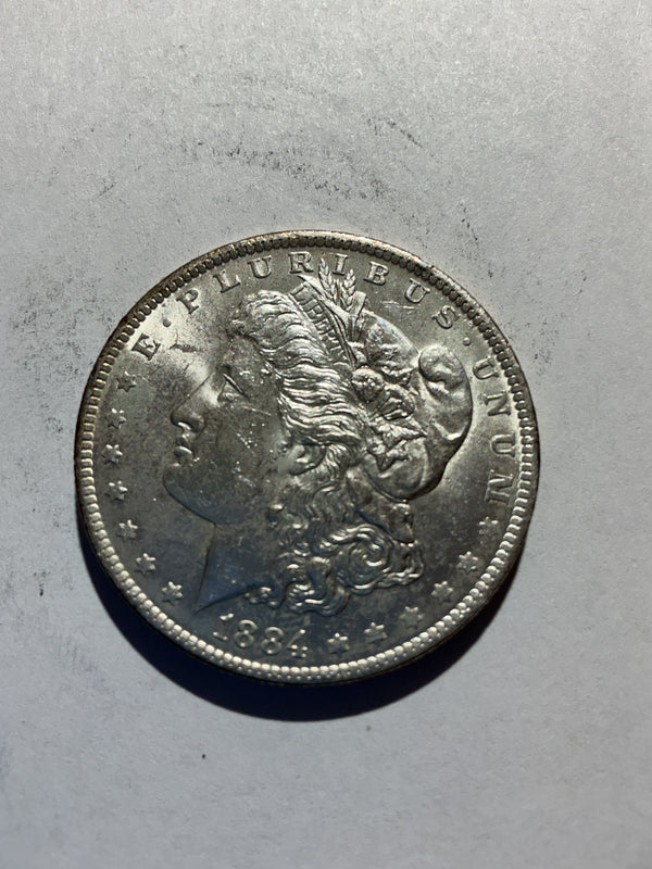 Lot 44, 1884 O Morgan silver dollar, AU