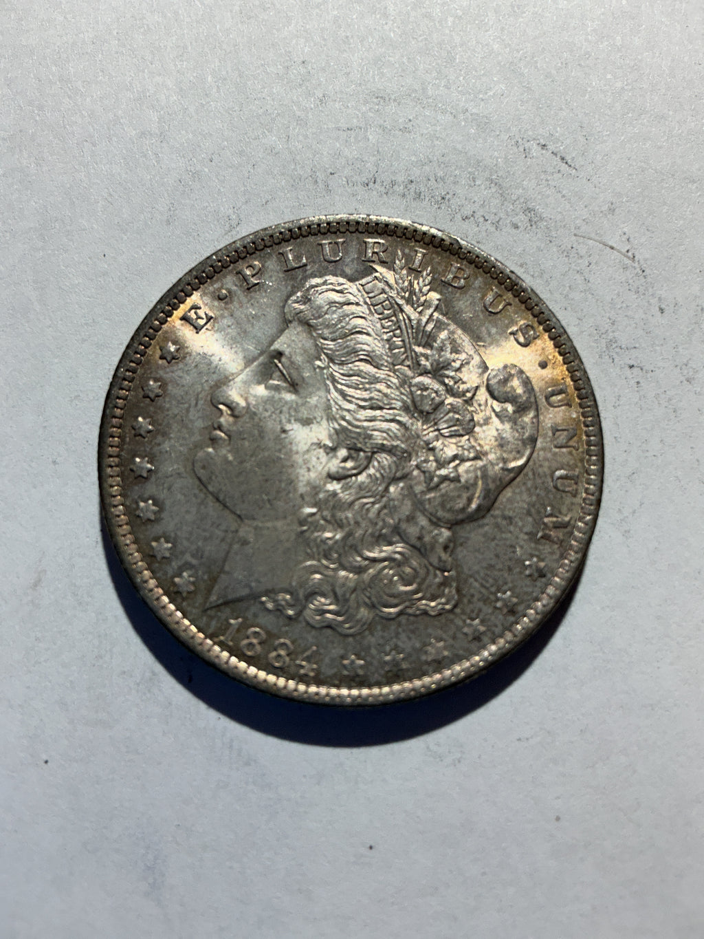 Lot 46, 1884 O Morgan silver dollar, AU