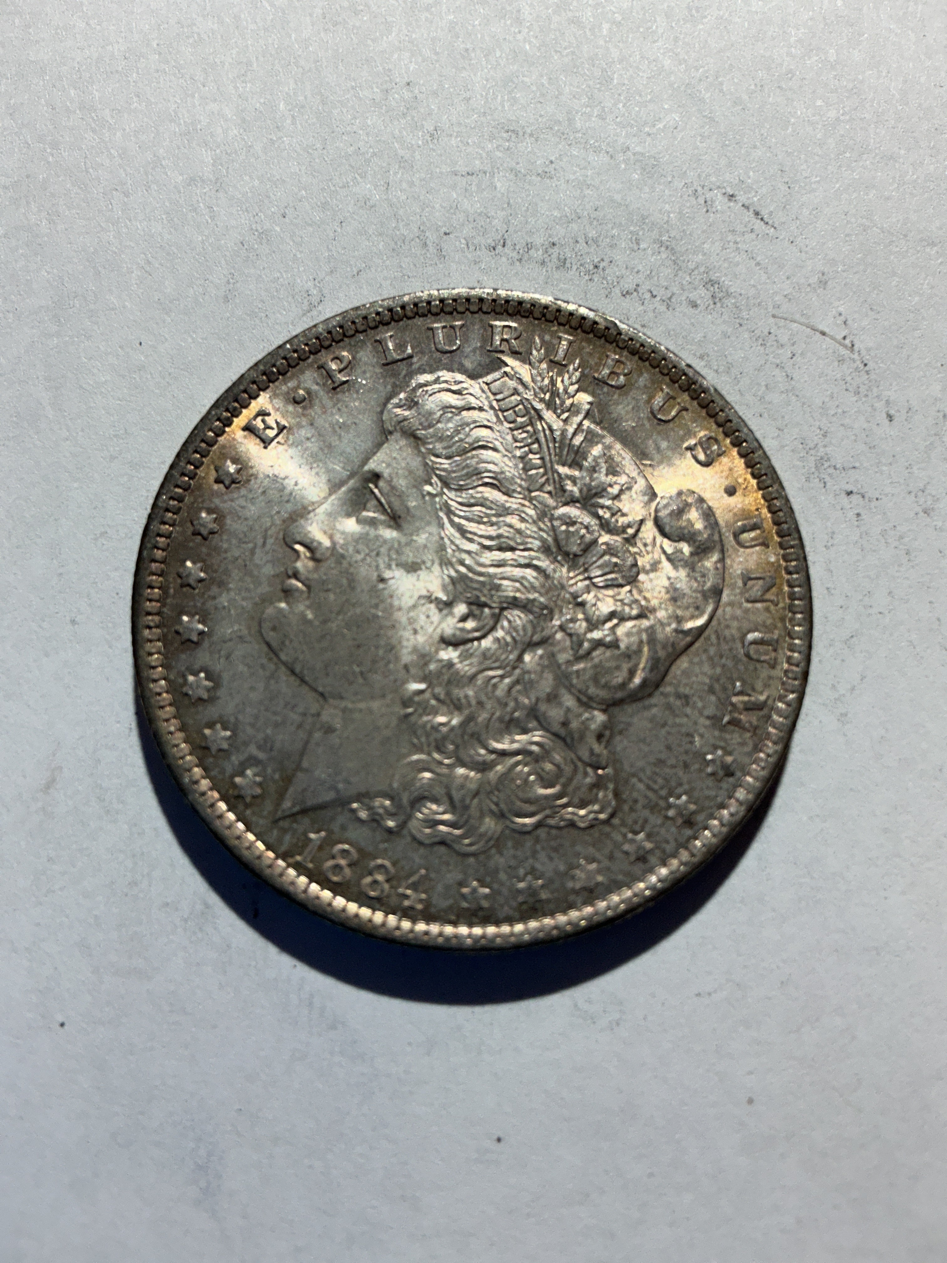 Lot 46, 1884 O Morgan silver dollar, AU