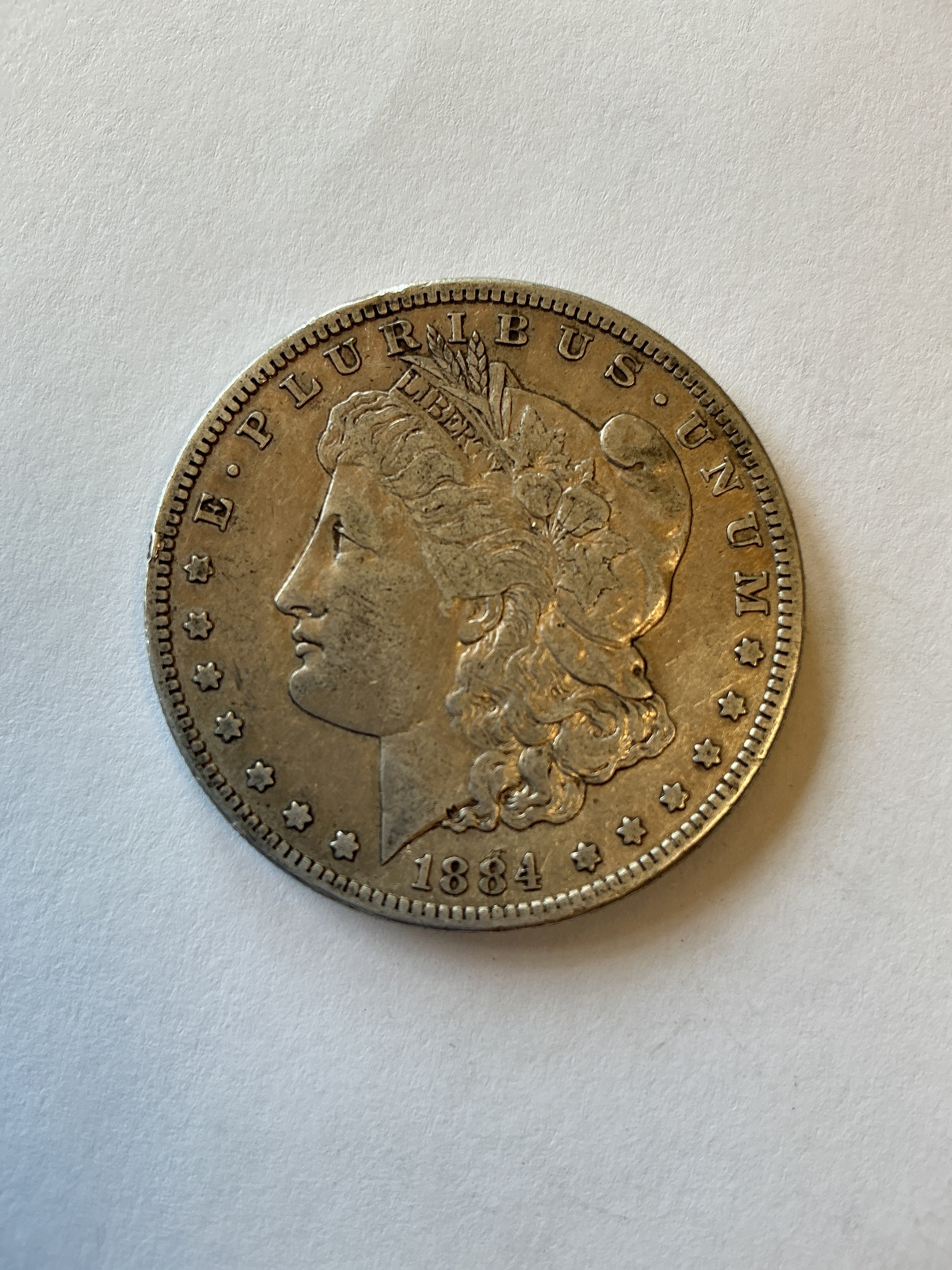 Lot 13, 1884 S Morgan silver dollar, XF