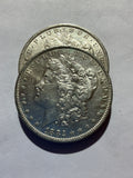 Lot 45, 2 1882 O Morgan silver dollar, AU