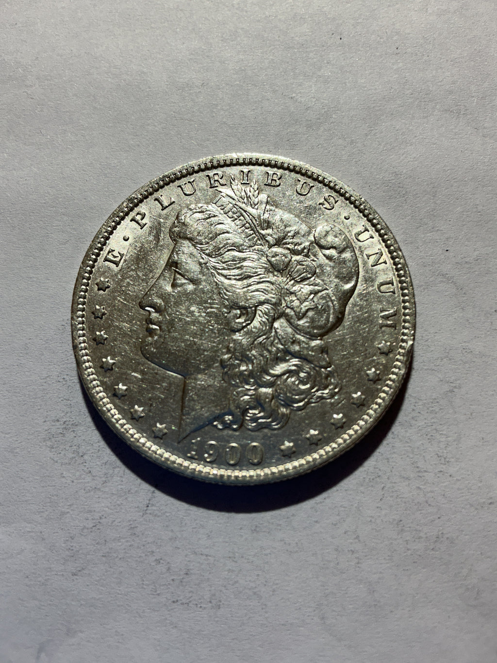 Lot 61, 1900 O Morgan silver dollar, AU