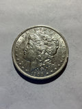 Lot 61, 1900 O Morgan silver dollar, AU