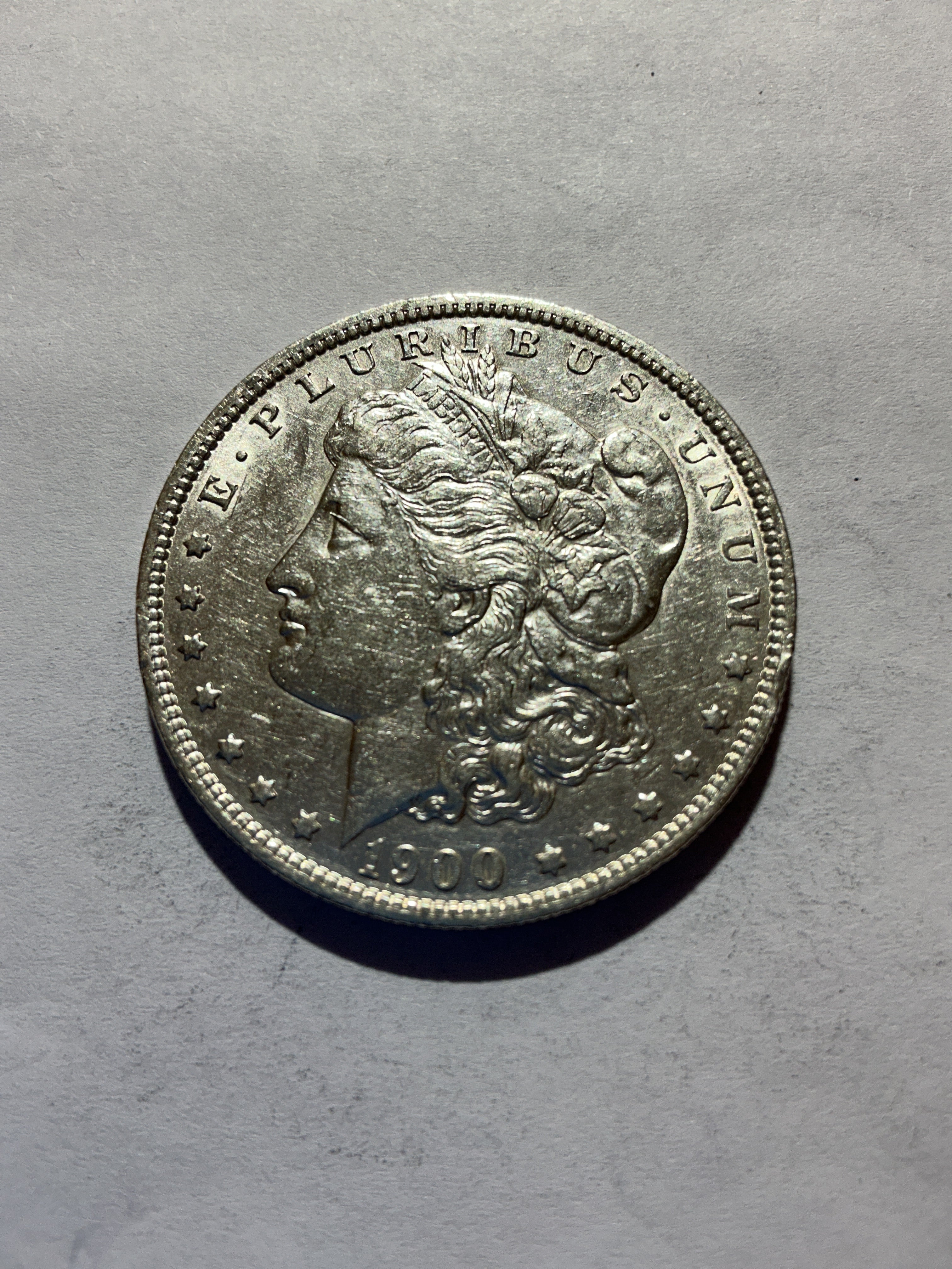 Lot 61, 1900 O Morgan silver dollar, AU