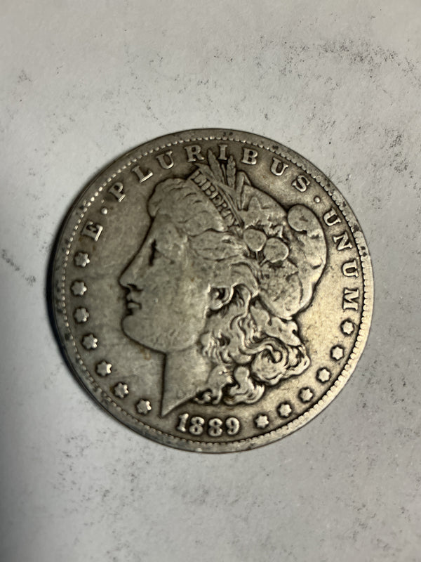 Lot 49, 1889 O Morgan silver dollar