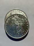 Lot 18, 2 1900 Morgan silver dollar, AU