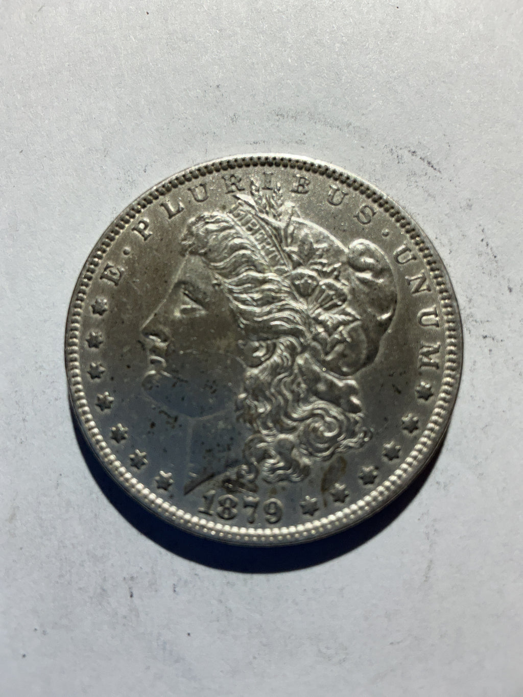 Lot 52, 1879 Morgan silver dollar, AU