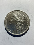 Lot 52, 1879 Morgan silver dollar, AU
