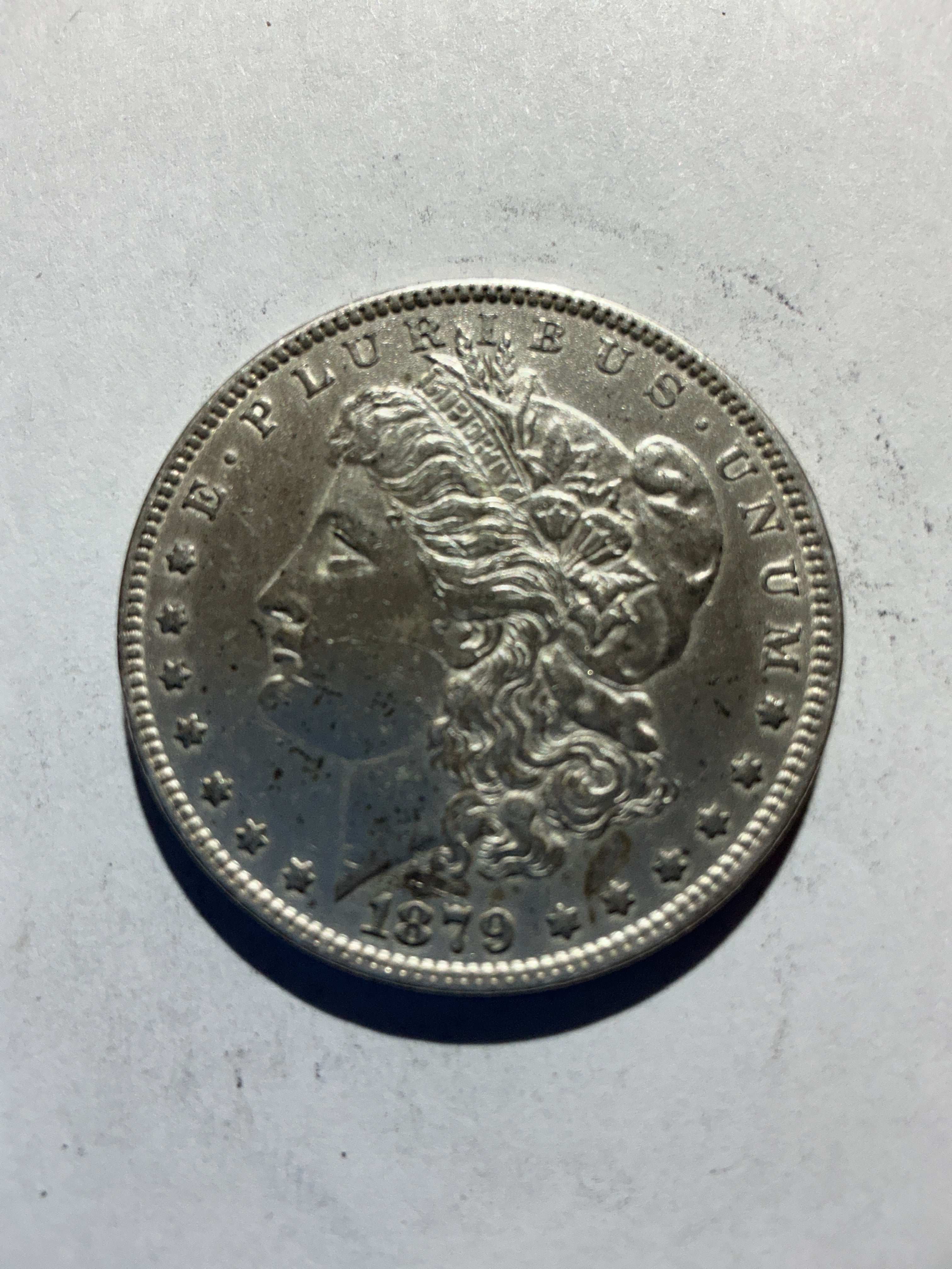 Lot 52, 1879 Morgan silver dollar, AU
