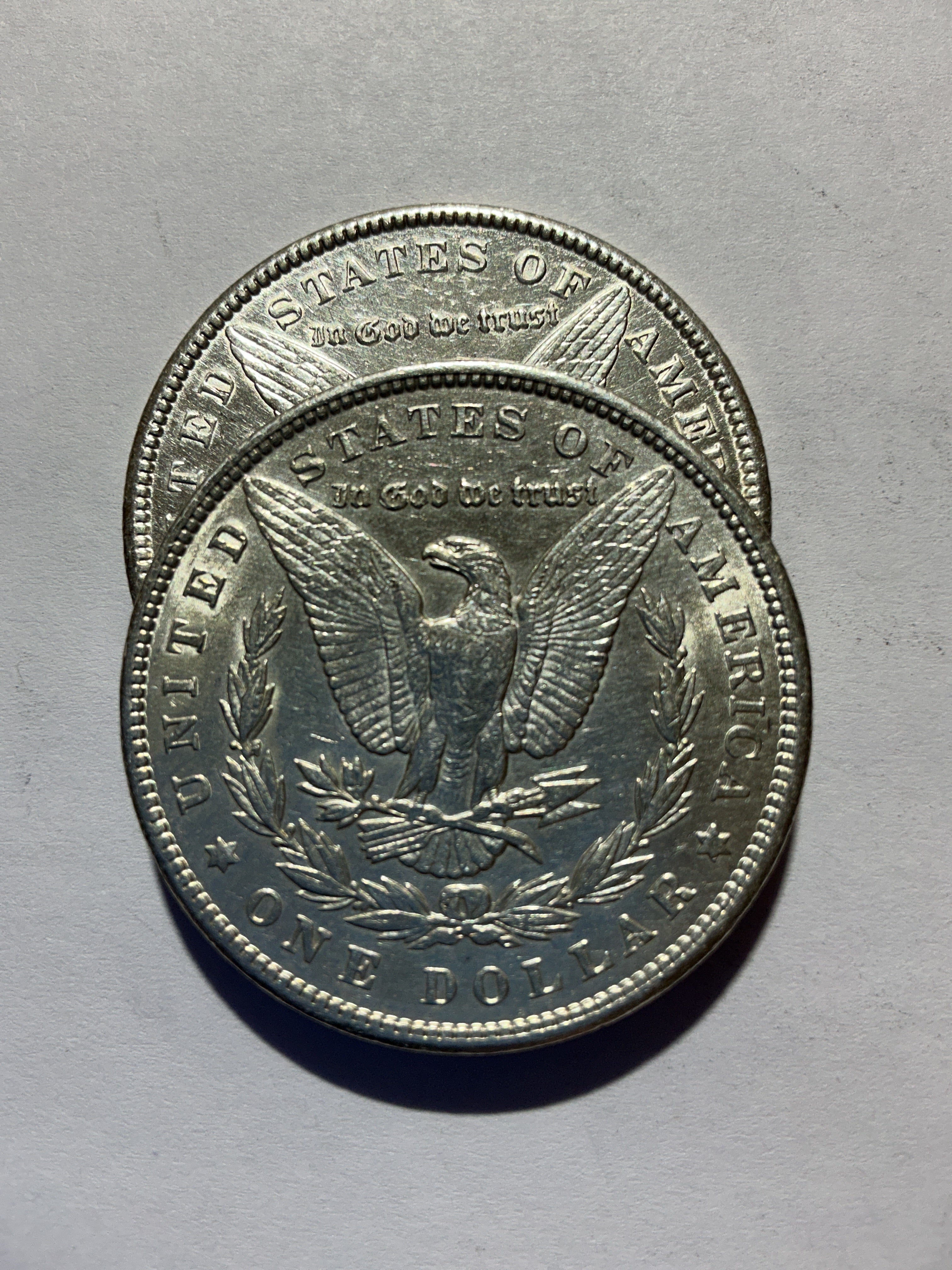 Lot 18, 2 1900 Morgan silver dollar, AU