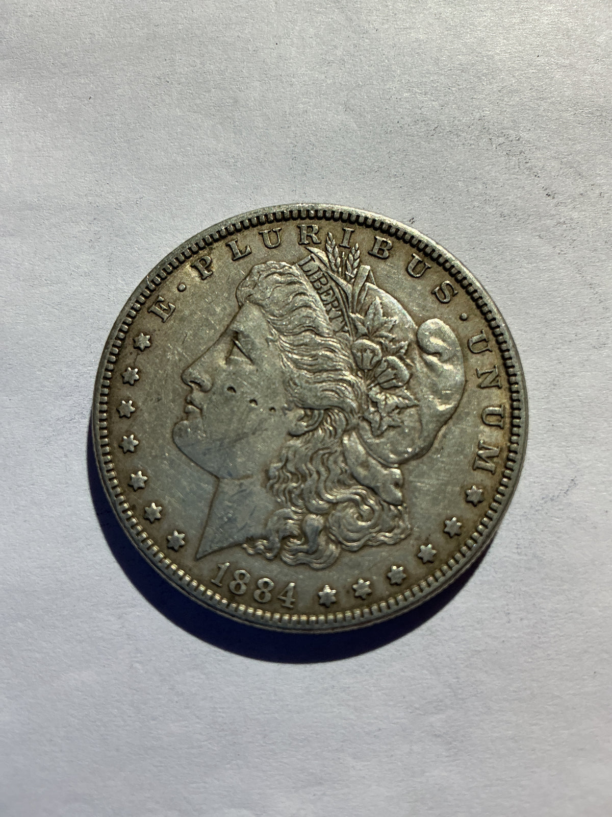 Lot 67, 1884 Morgan silver dollar