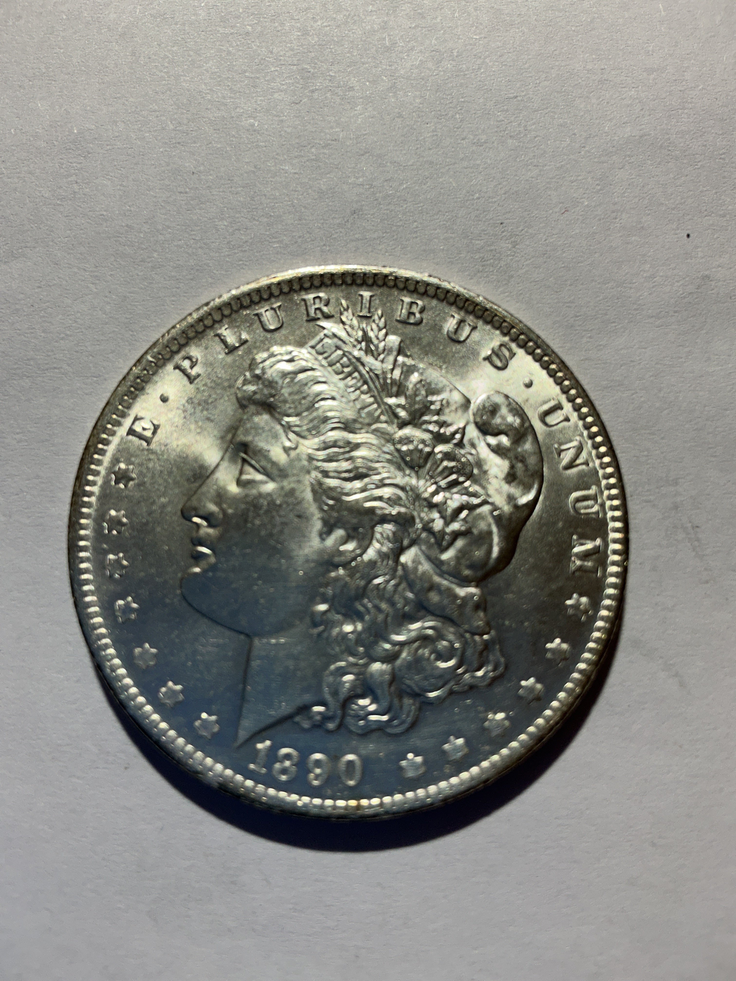 Lot 75, 1890 O Morgan silver dollar, BU