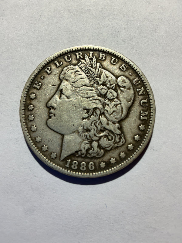 Lot 15, 1886 Morgan silver dollar, VF