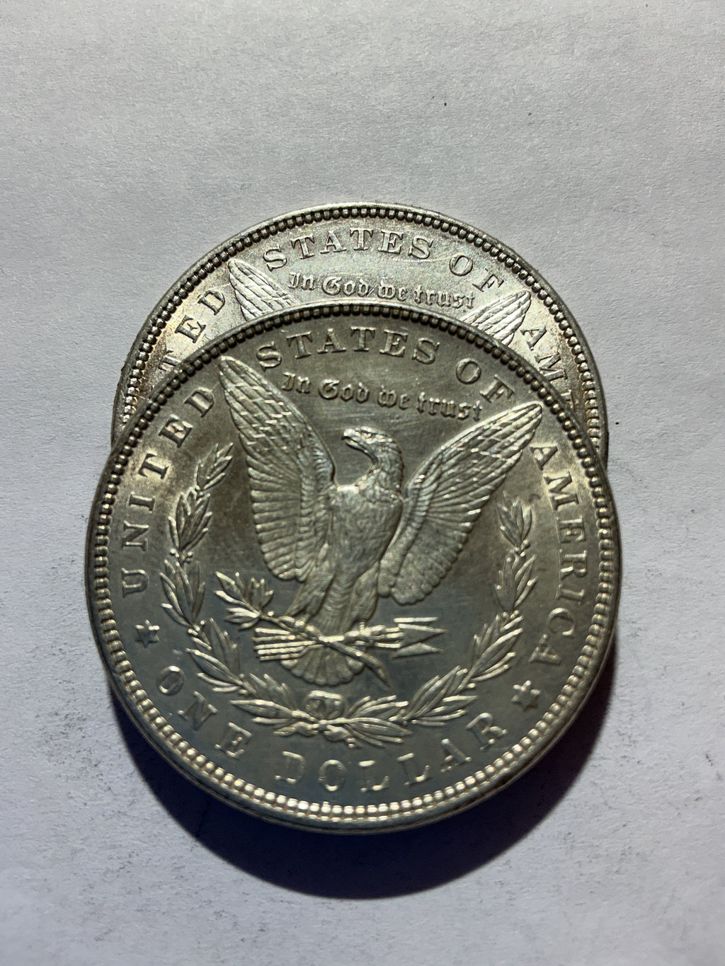 Lot 60, 2 1898 Morgan silver dollar, AU