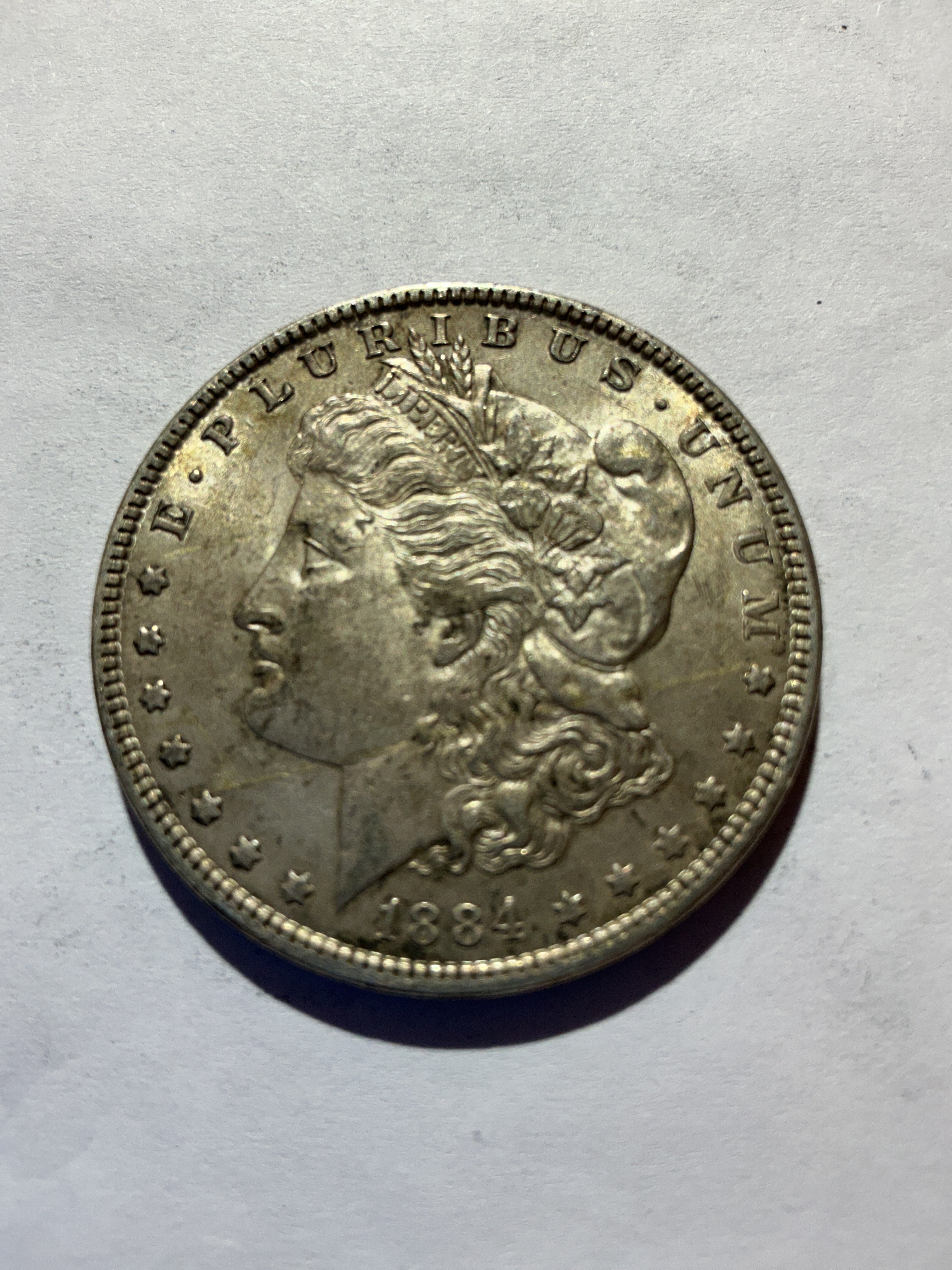 Lot 50, 1884 Morgan silver dollar, AU