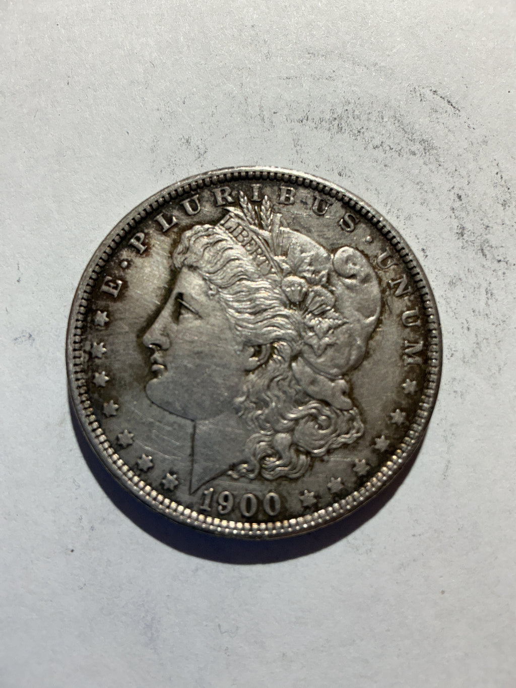 Lot 63, 1900 Morgan silver dollar, AU