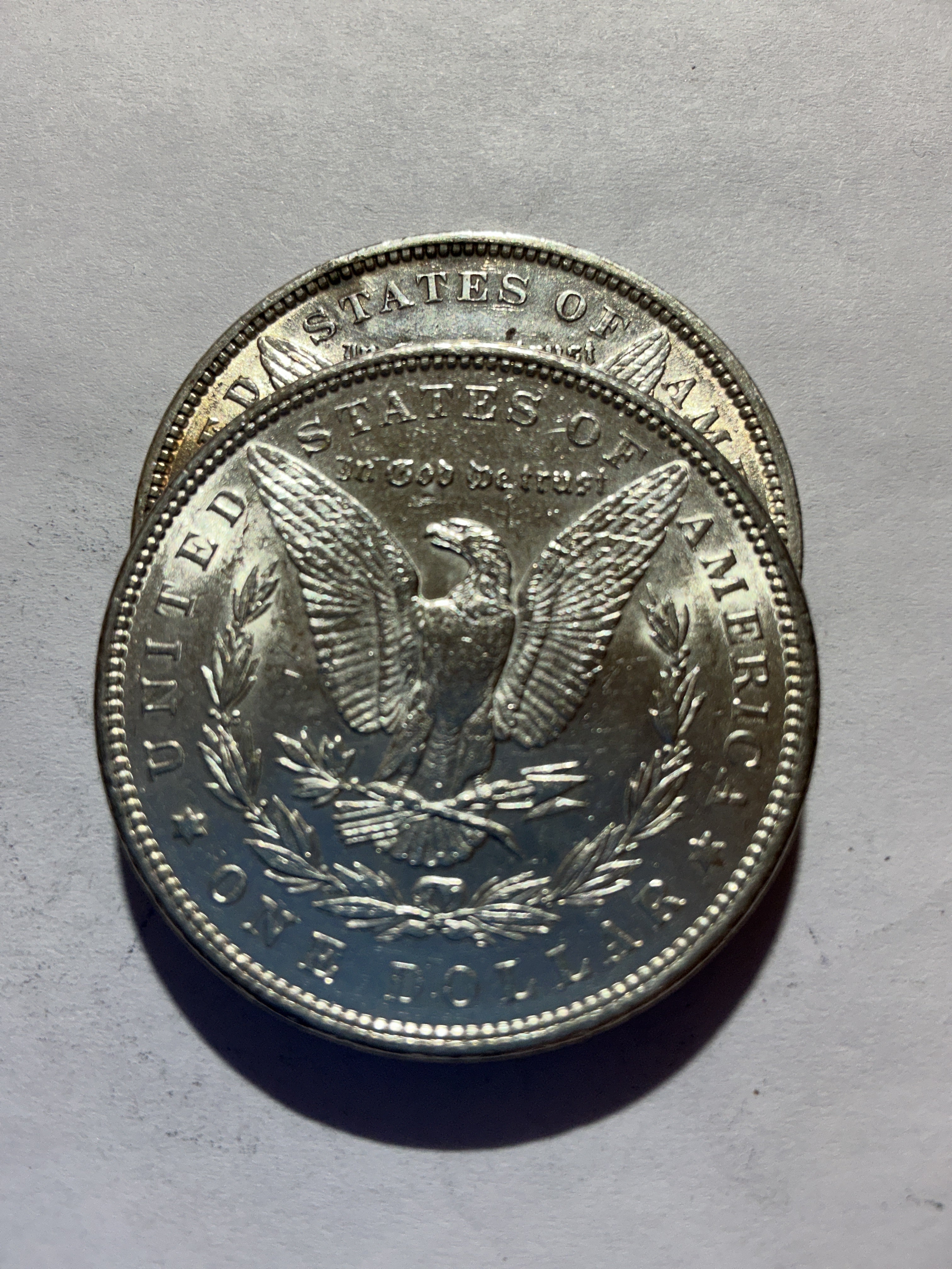 Lot 56, 2 1889 Morgan silver dollar, AU